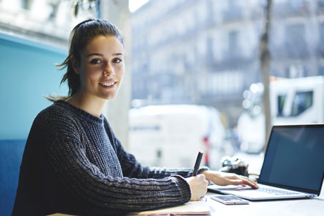 Woman in cafe submitting application.